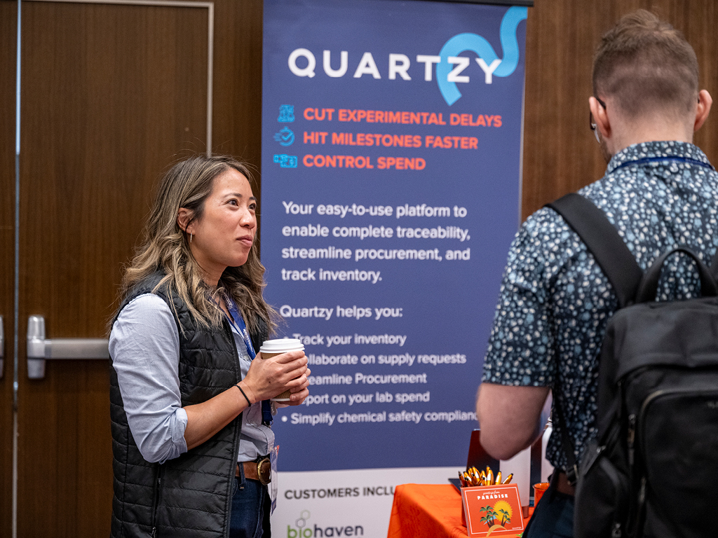 Leadership Summit exhibitors conversing with attendees in the exhibit hall